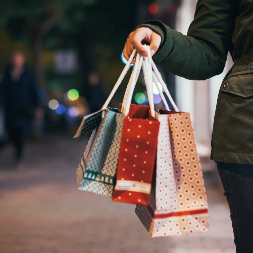 holding shopping bags