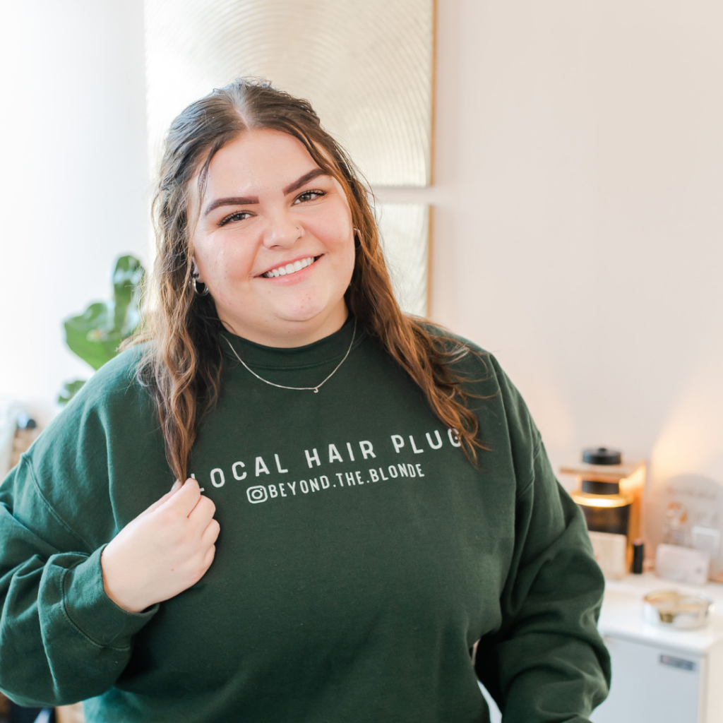 Member wearing their brand's shirt